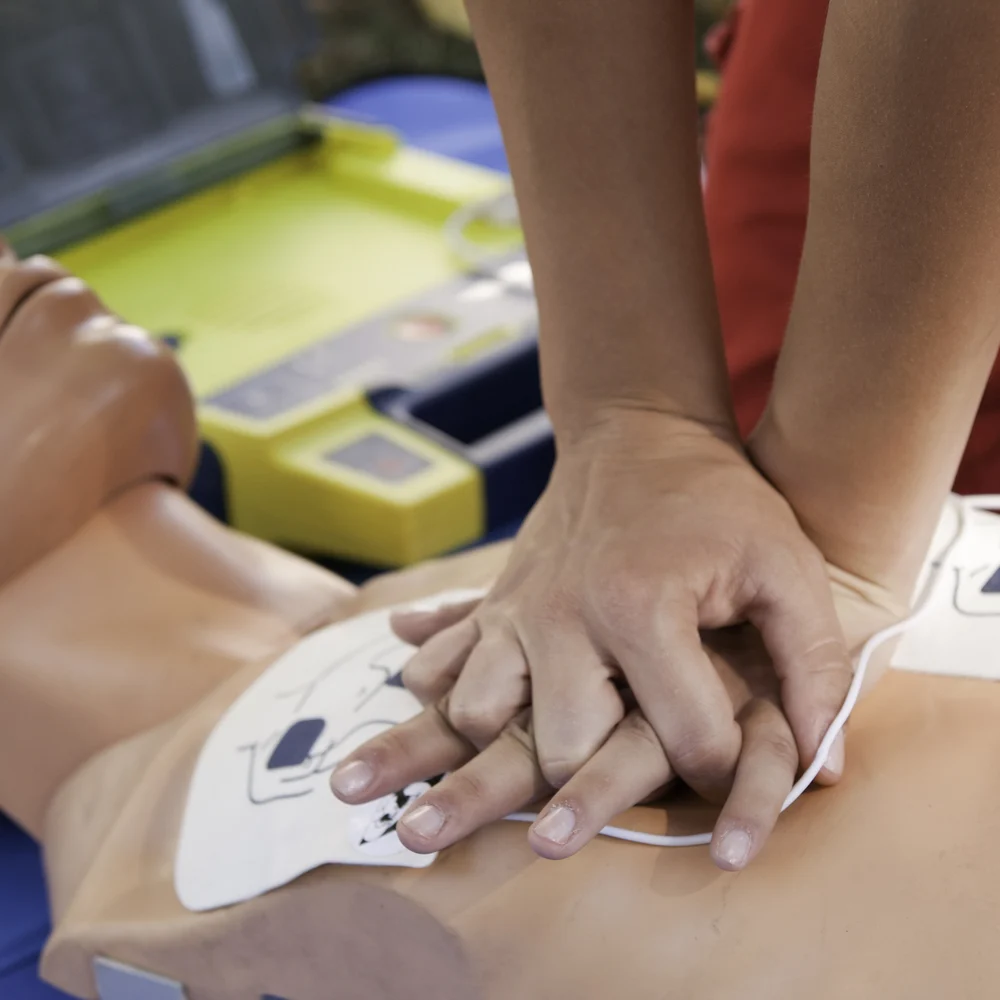 First aid training session in Melbourne showing patient care and bandaging