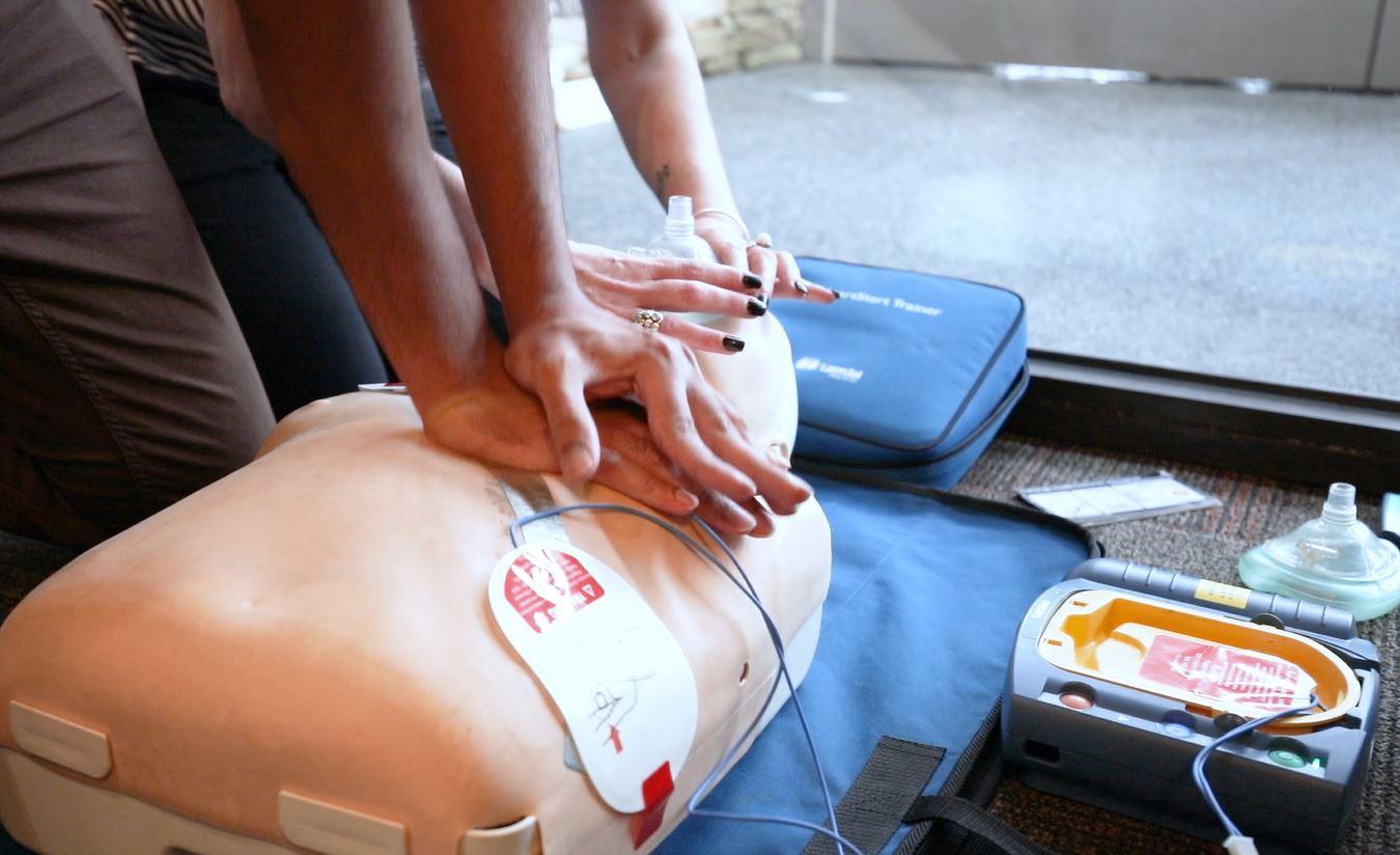 CPR and resuscitation training course in Melbourne, demonstrating chest compressions and AED use